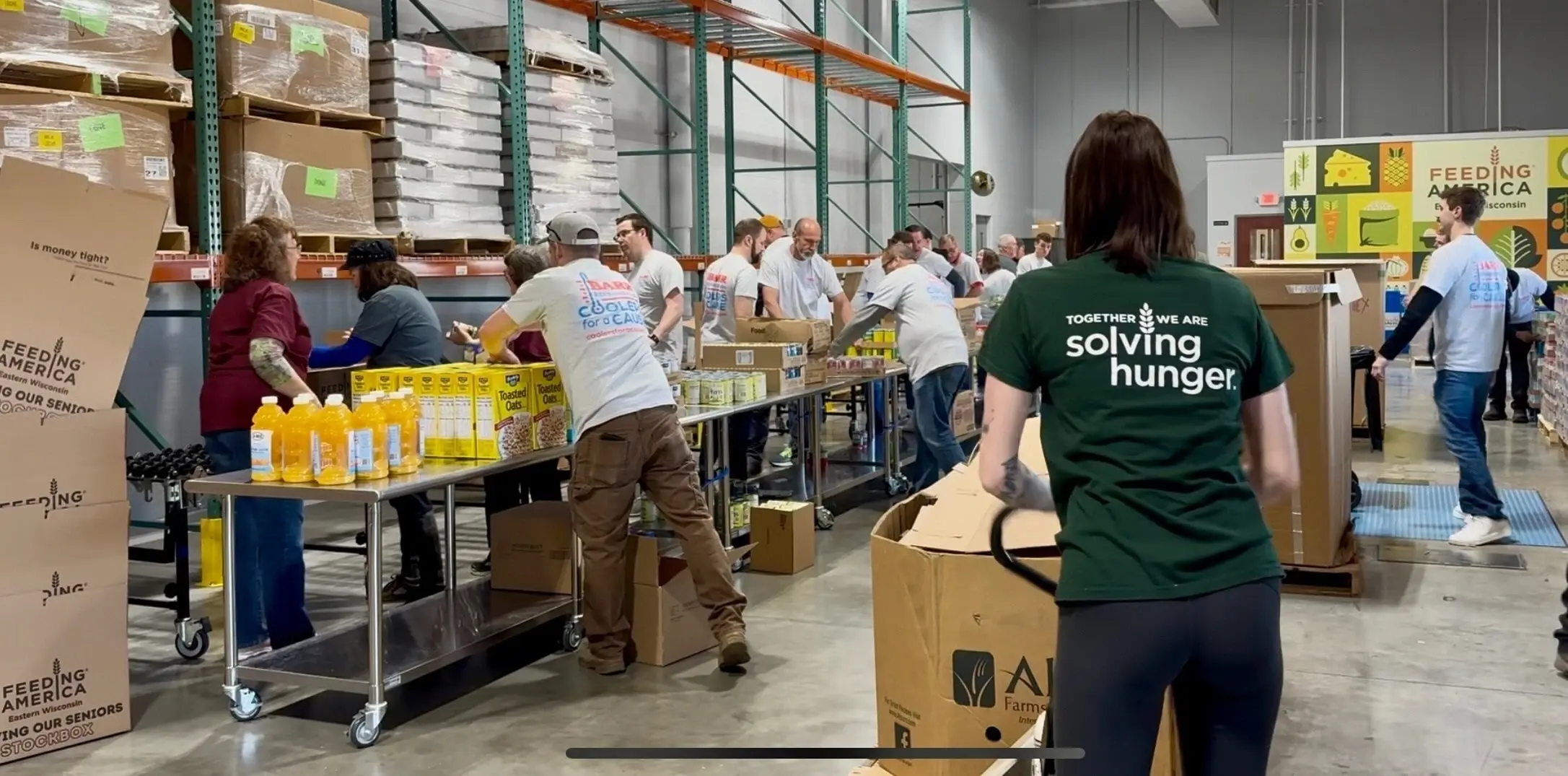 Barr Refrigeration volunteers working alongside Feeding America Eastern Wisconsin staff at the Appleton, WI distribution facility
